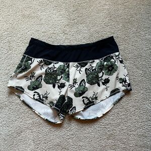 Oiselle Roga Black and Green Floral Athletic Shorts
